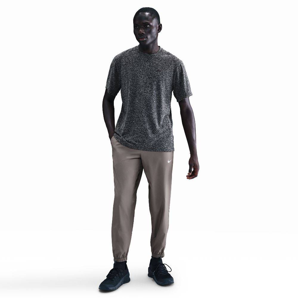 NIKE DRI-FIT TAPERED VERSALITE TROUSERS