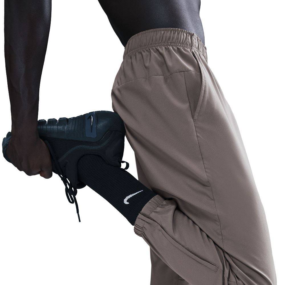 NIKE DRI-FIT TAPERED VERSALITE TROUSERS