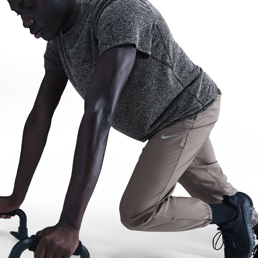 NIKE DRI-FIT TAPERED VERSALITE TROUSERS