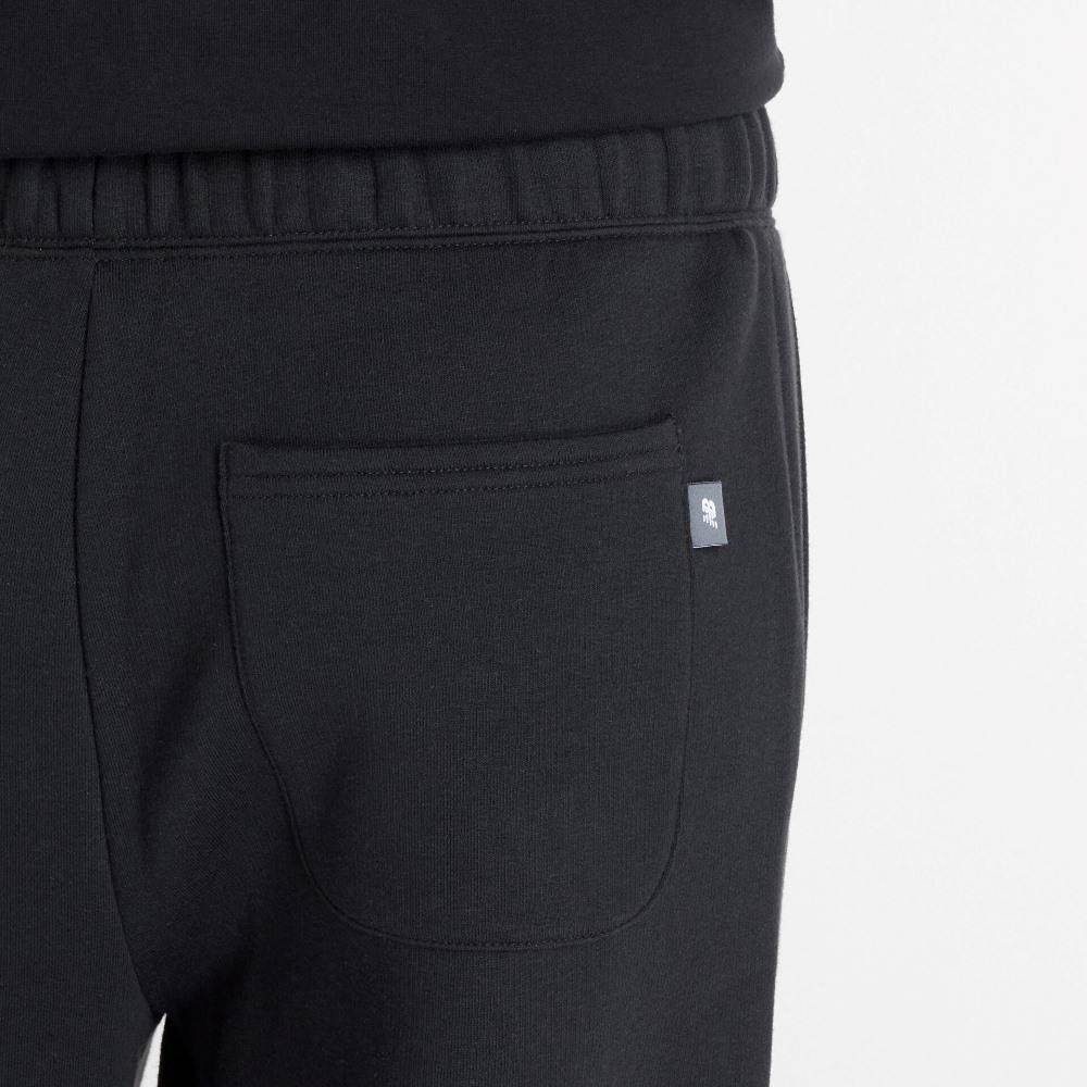 NEW BALANCE LINEAR HERITAGE FLEECE BARREL LEG PANT