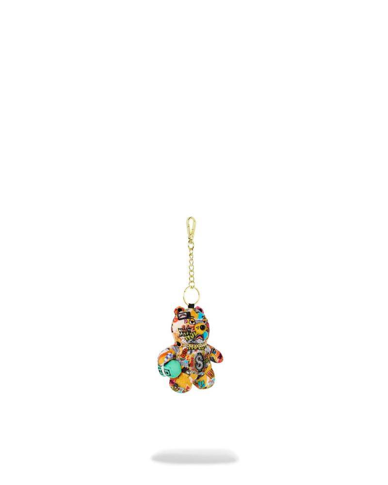 SPRAYGROUND MAGAZINE COLLAGE BEAR KEYCHAIN